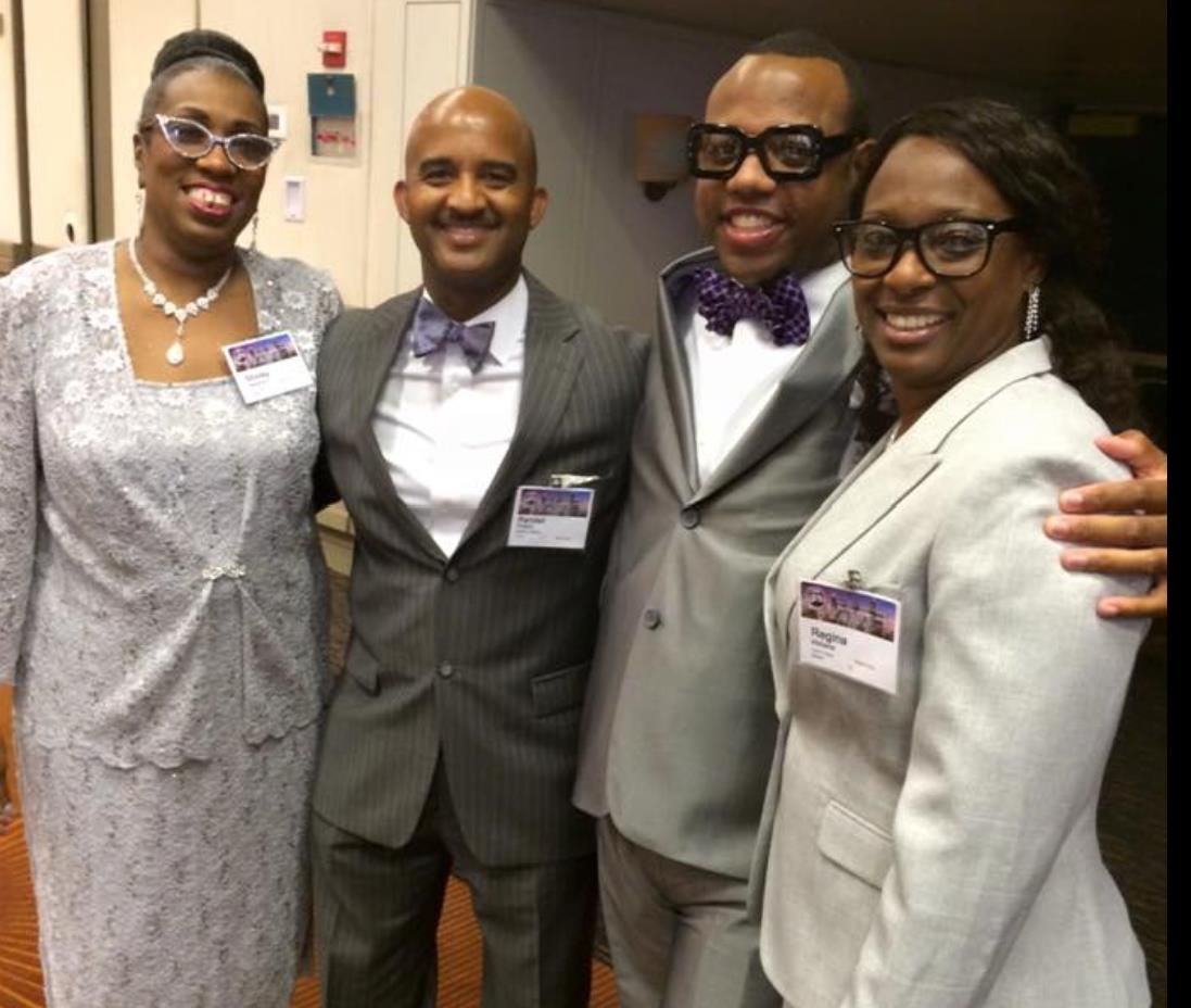 Members dressed in silver at formal event